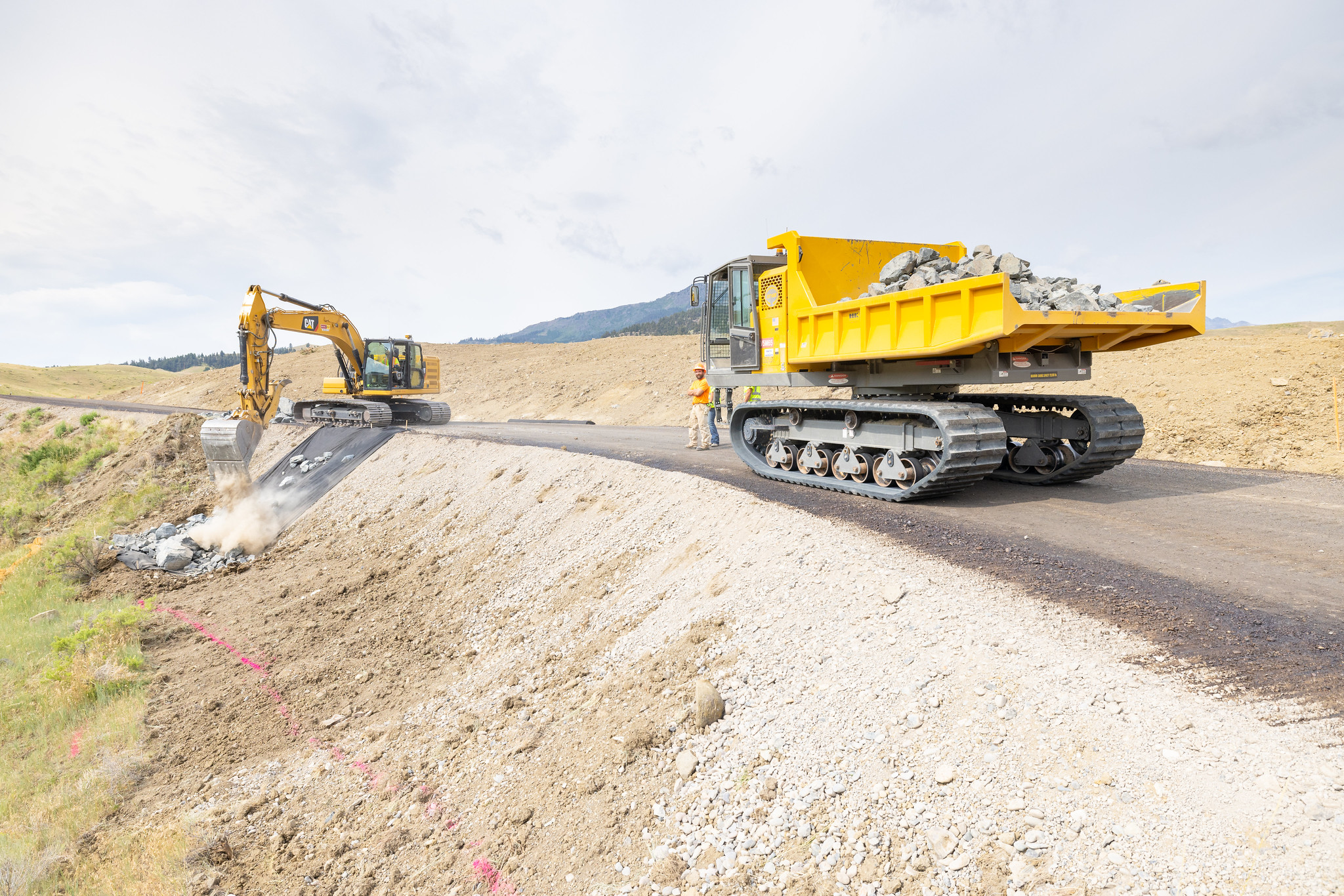 Heavy equipment driving and working from a stabilized construction road