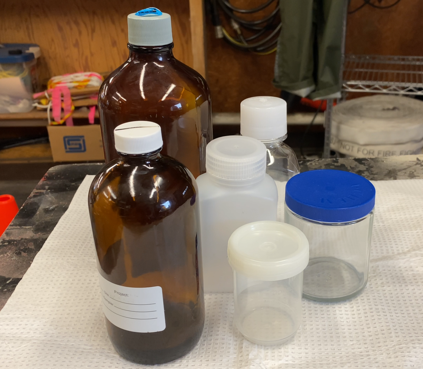 6 generic sampling bottles of various shapes and sizes