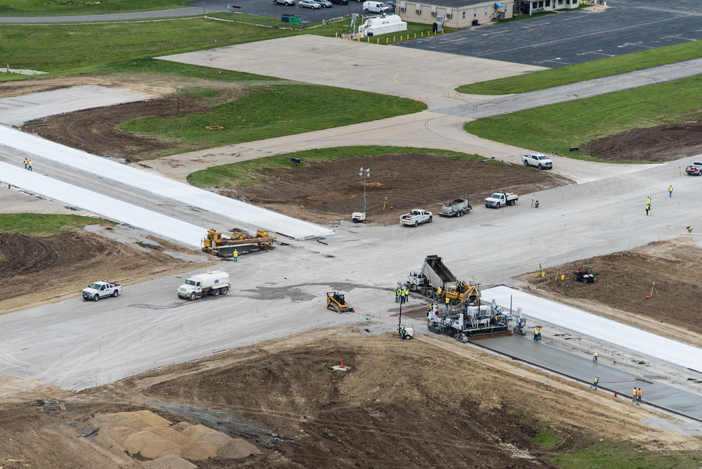 Birds eye view of construction site with equipment parked on gravel areas